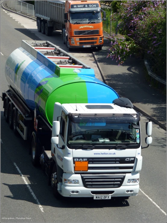 a large colorfully painted truck is in traffic