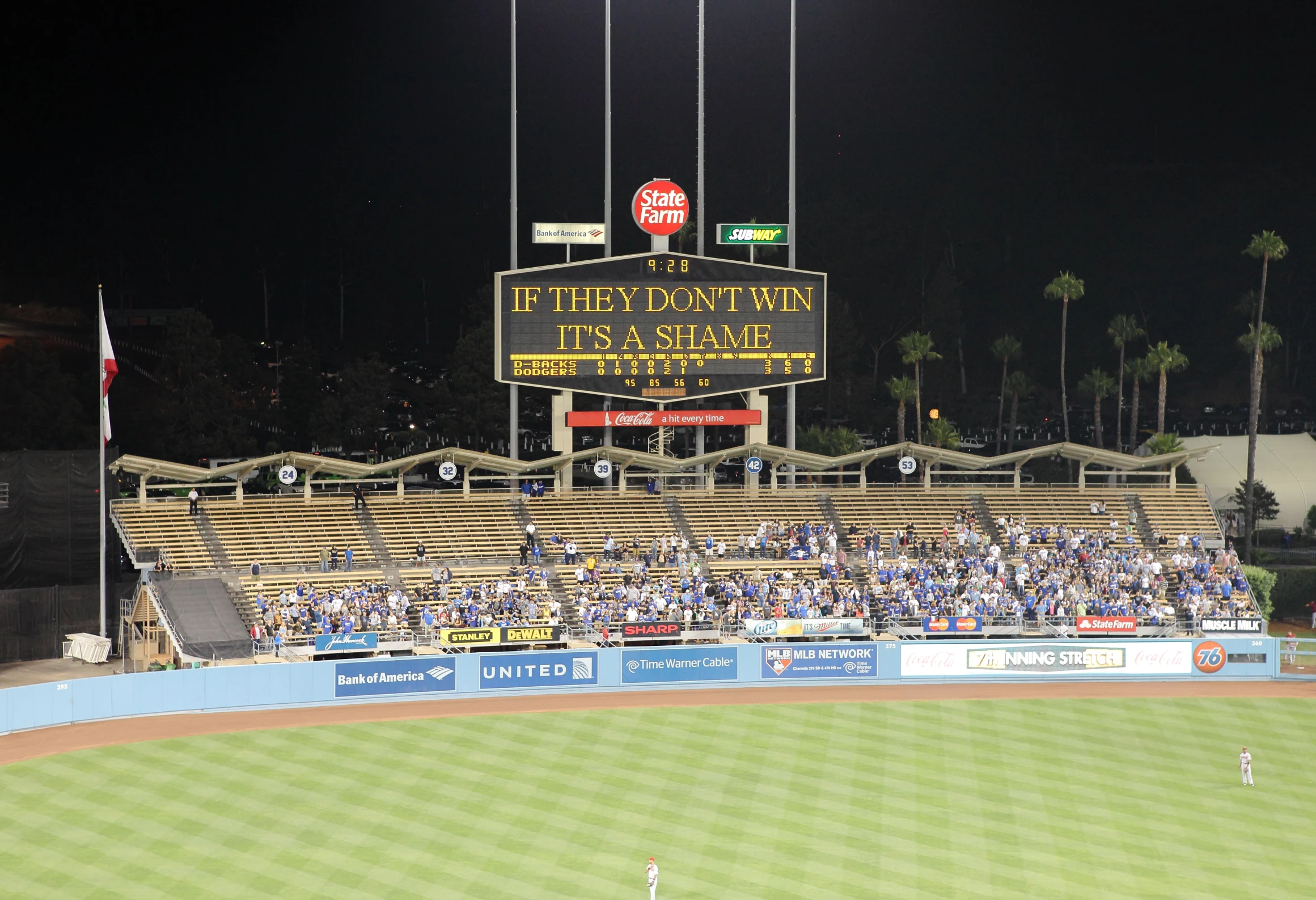 many people are sitting in the bleachers watching an event