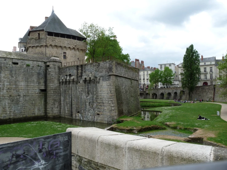 old brick buildings and walls by a river