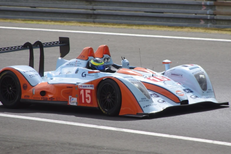 a very small race car driving on the track