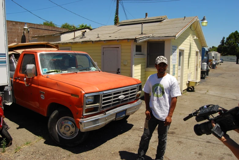 a guy that is standing in front of a truck