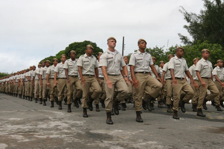 a man leading a military unit down the street