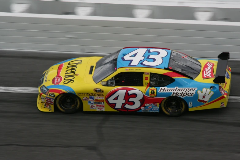 a racing car driving down the track in an auto race