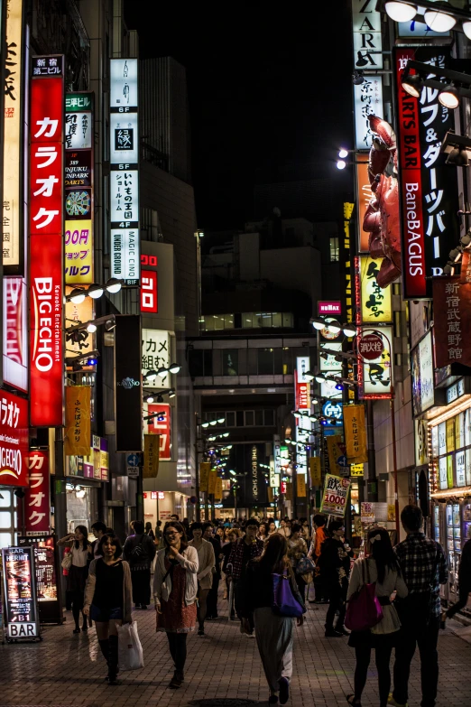 a city square is covered with glowing signs