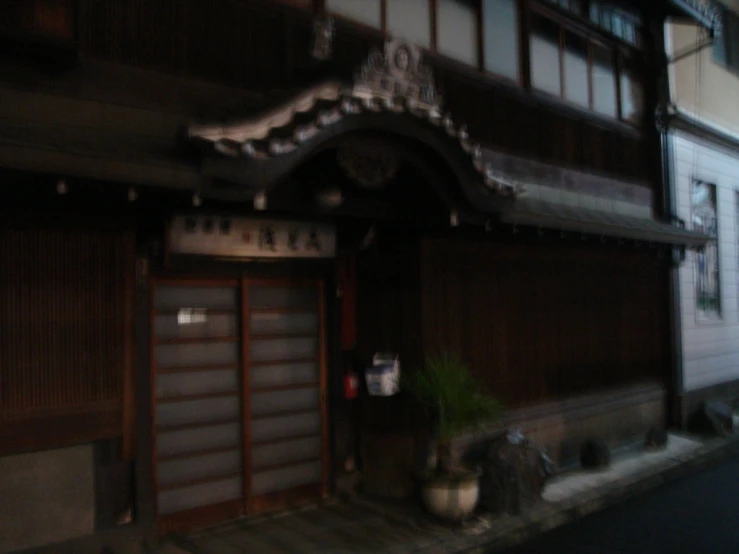 an empty street and a building with a decorated front door