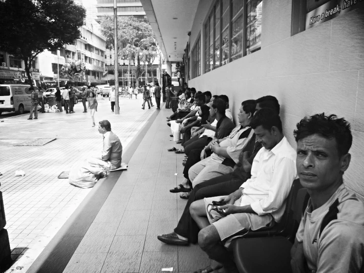 a black and white po of people on a curb