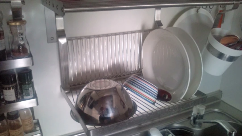 a kitchen with an oven and some pots