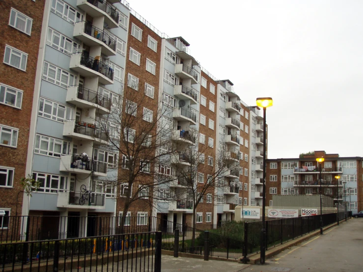 an outside view of apartment buildings, including several balconies