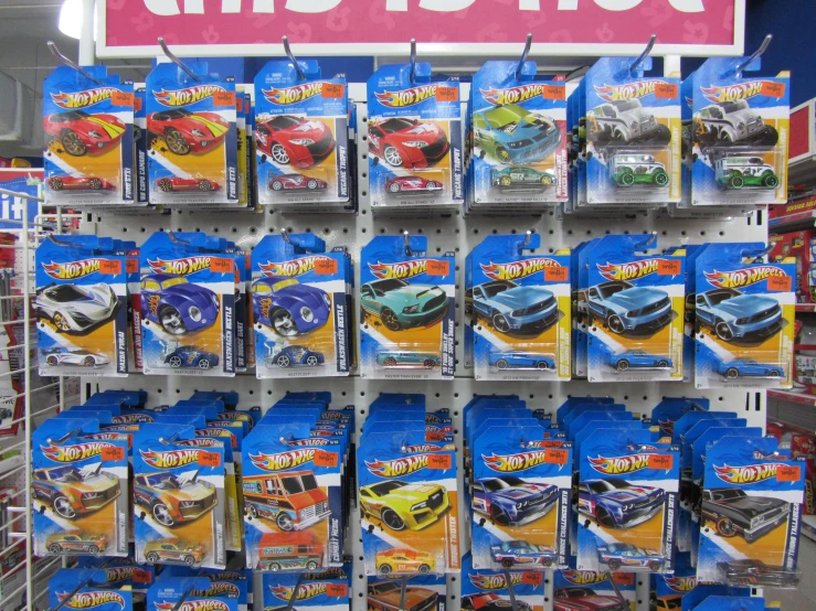 a bunch of  wheels toys on display in a store