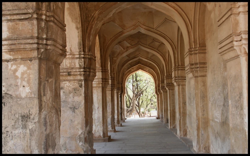 an old, arched building with many pillars