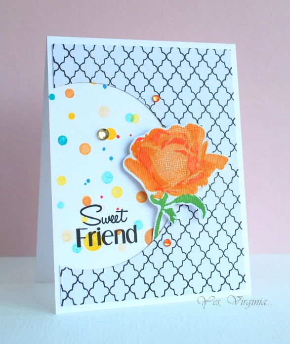 a card with a pink flower on top