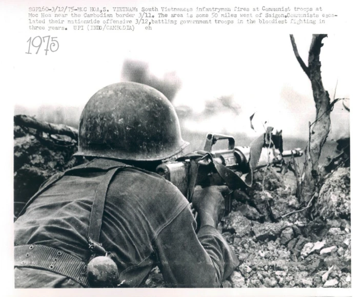 a military soldier looks into a distance in black and white