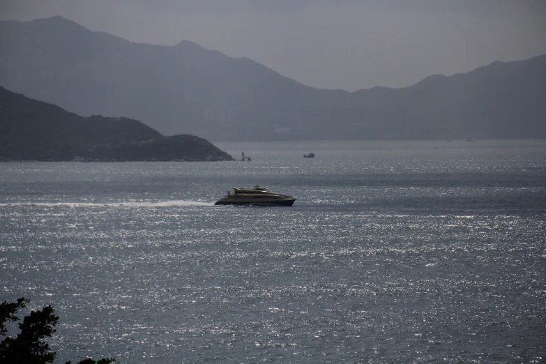 a boat in the ocean on a misty day