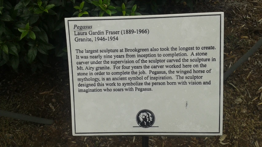 a plaque describing the origin of garden plants