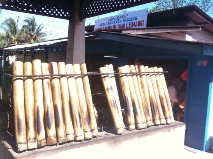 a row of large wooden posts on the outside