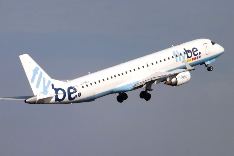 a commercial plane flies in the sky on a clear day