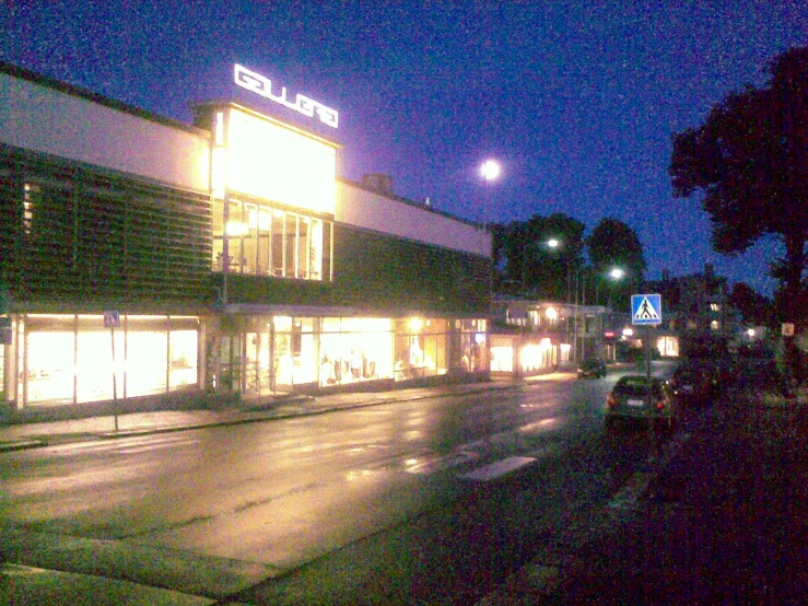 an empty shopping center at night time