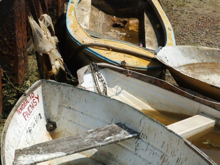 rowboats are pulled up on the side of a wall