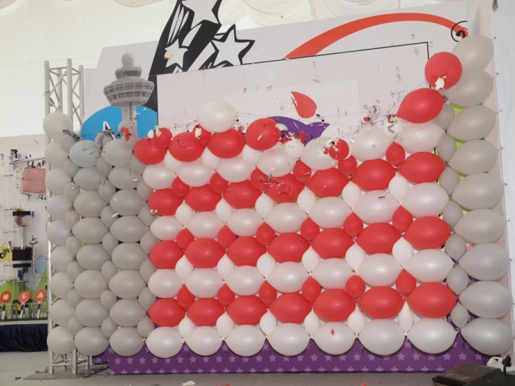 an american flag made of balloons is displayed