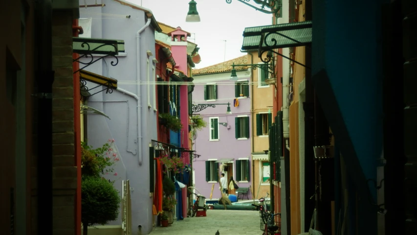 there are many colorful buildings on the street