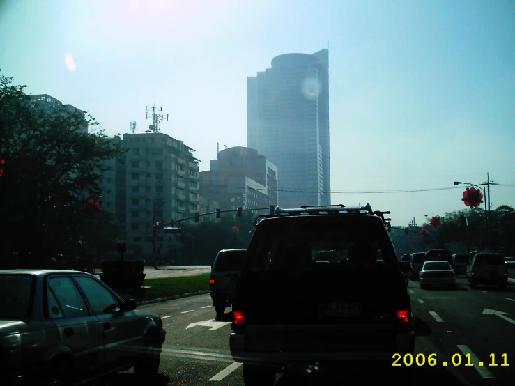 there are cars and a bus on a city street