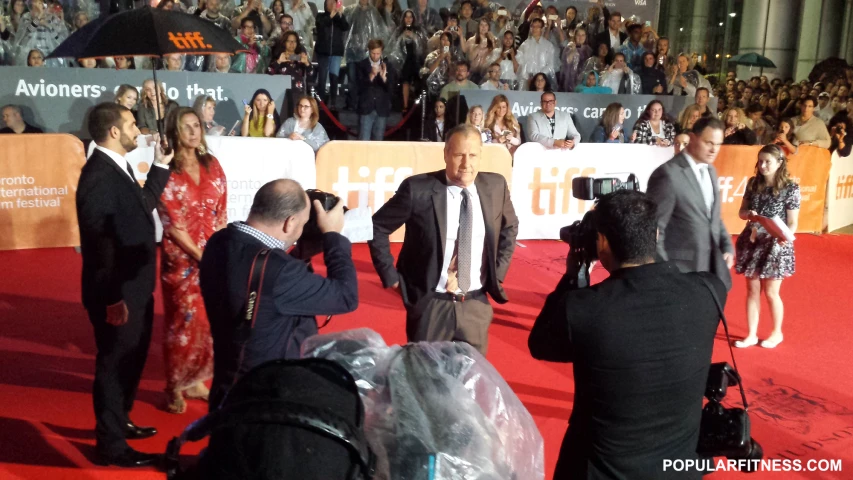 people are taking pictures on the red carpet