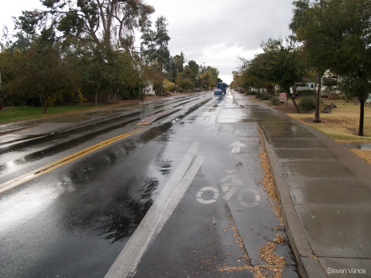 there is a bike that is painted on a wet street