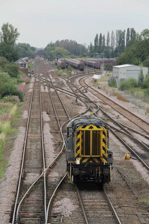 a small train that is coming down the tracks