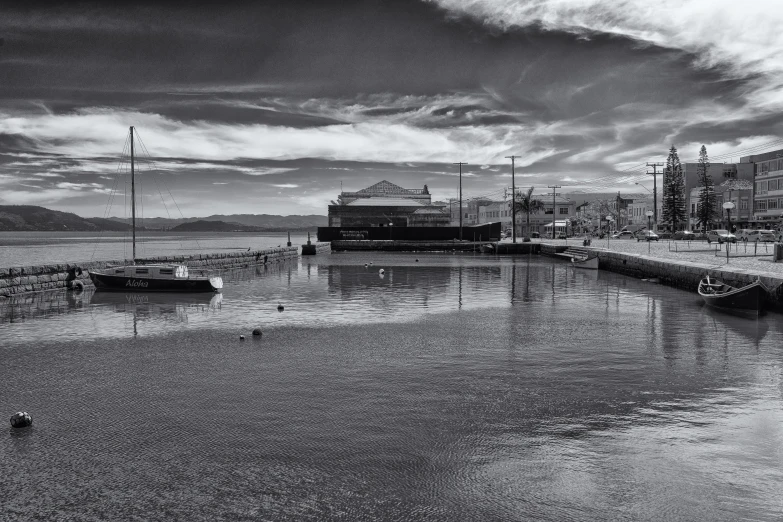 boats tied to a dock on the sea side