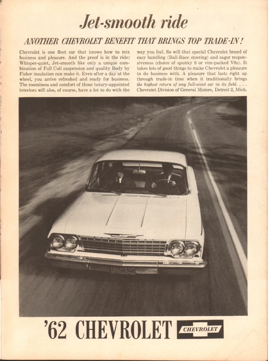 a white chevrolet belil being driven on a highway