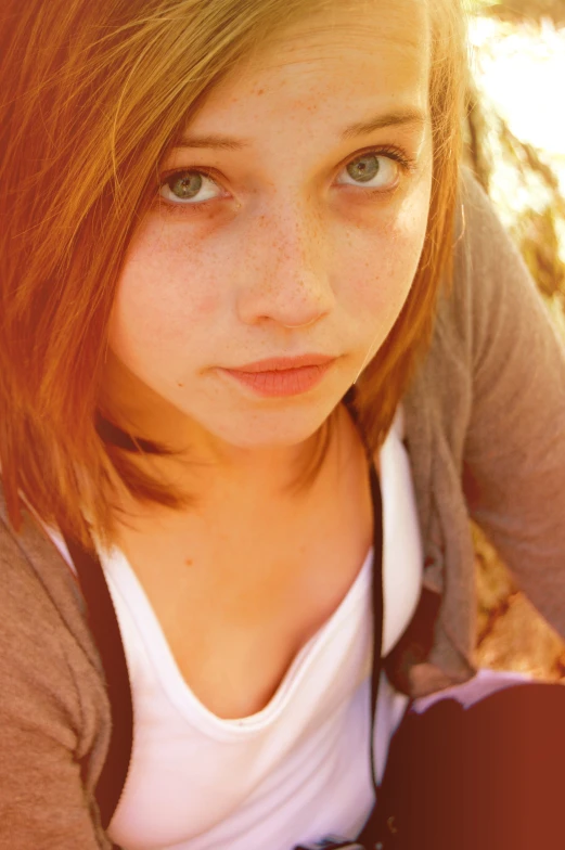  posing for camera in park with light background