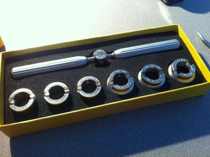 a set of metal tools are in a box