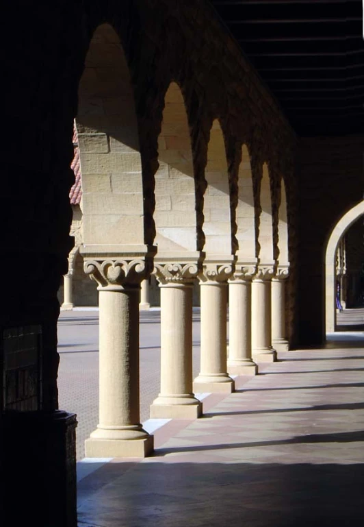 arches and pillars are lined by a brick wall