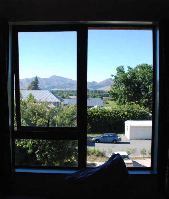 view of an out of place parking lot from the inside of a house