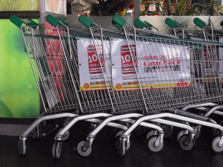 the shopping carts are lined up and waiting to be bought