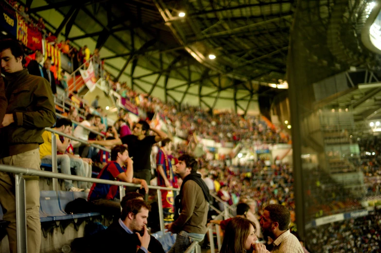 several people seated in seats in an arena