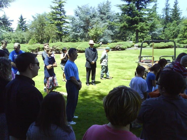 group of people on a field with a man in front