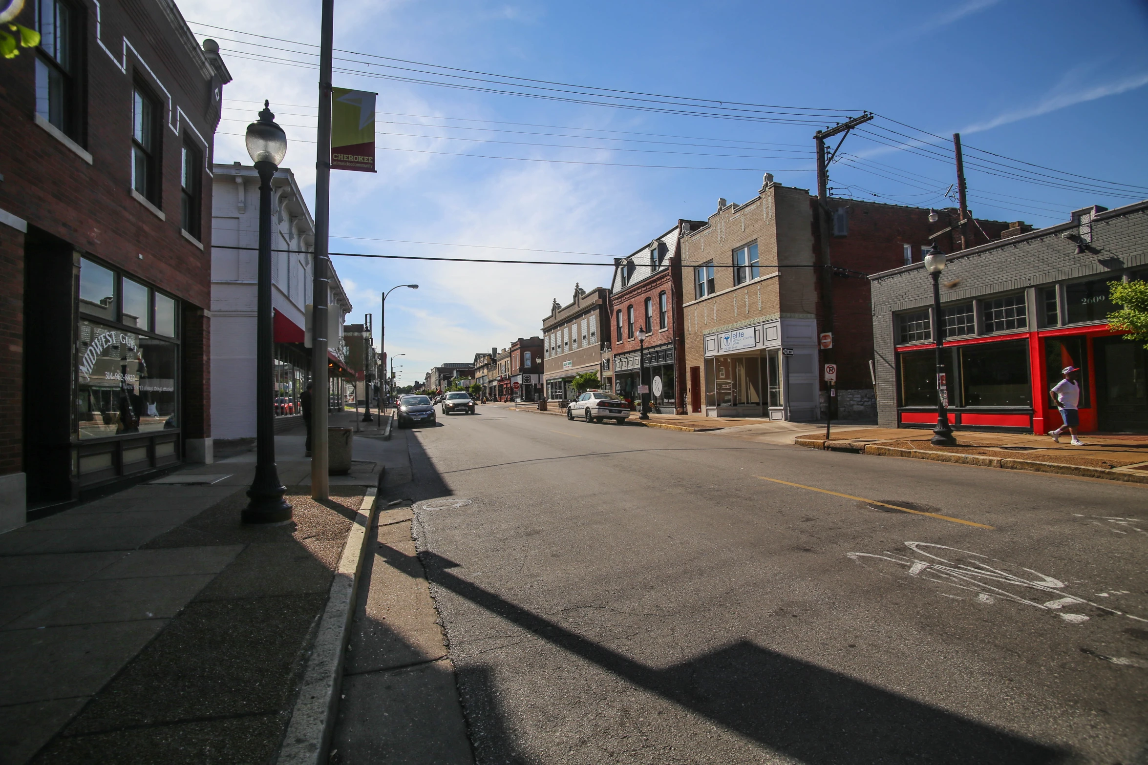 a road with several stores in the middle of it