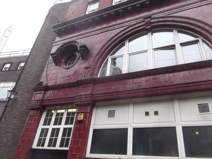 large, tall brick building with white doors and windows