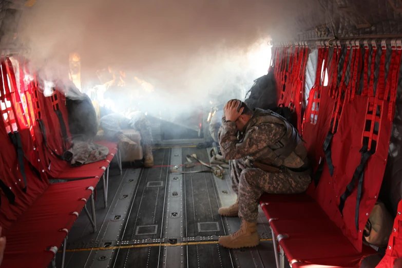 a soldier sits on a red bench in the back