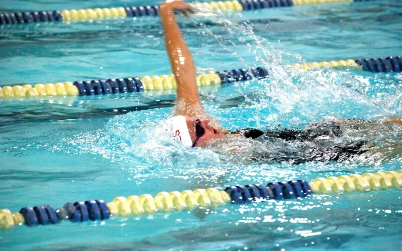 an image of a woman swimming in a pool