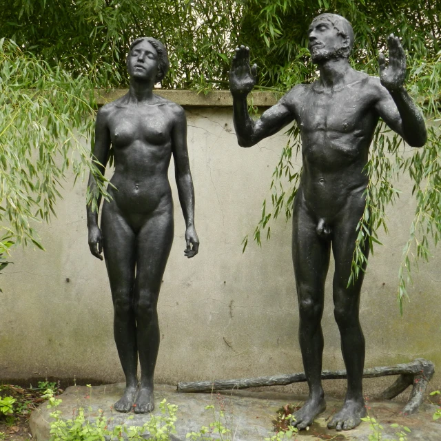two statues that are standing next to each other