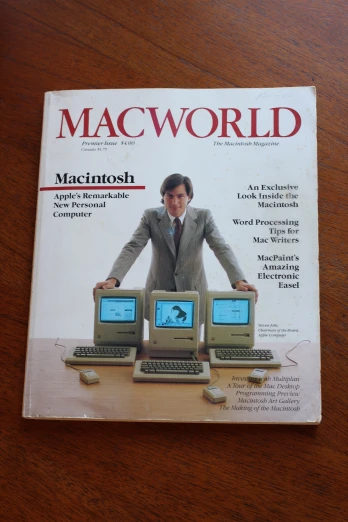 a book on computer programming with a man in a suit surrounded by computer keyboards