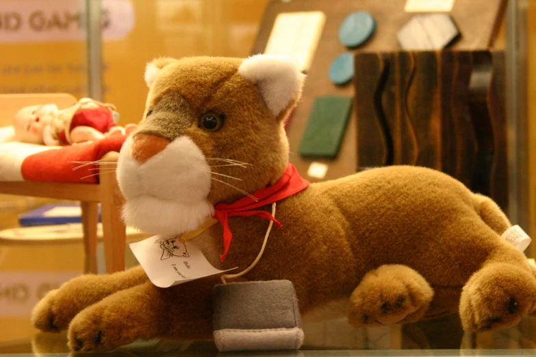 a small stuffed animal next to a wooden chair