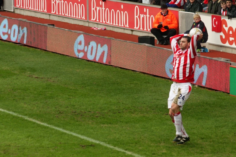 a man with the soccer ball in his hands