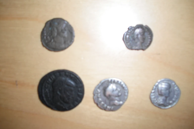 a collection of three coin's and a quarter's