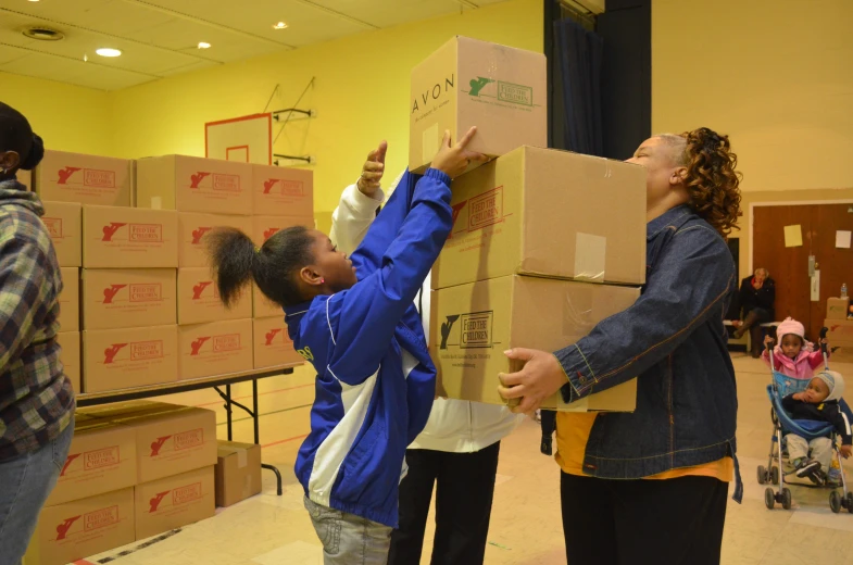 a man and  move boxes in a room