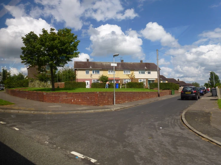 cars parked in front of a row of homes