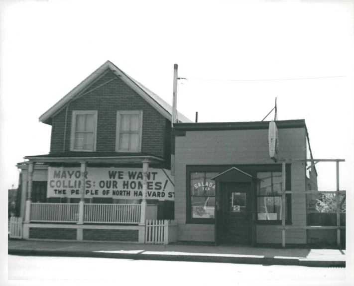 this old building has a sign for mayoof in it