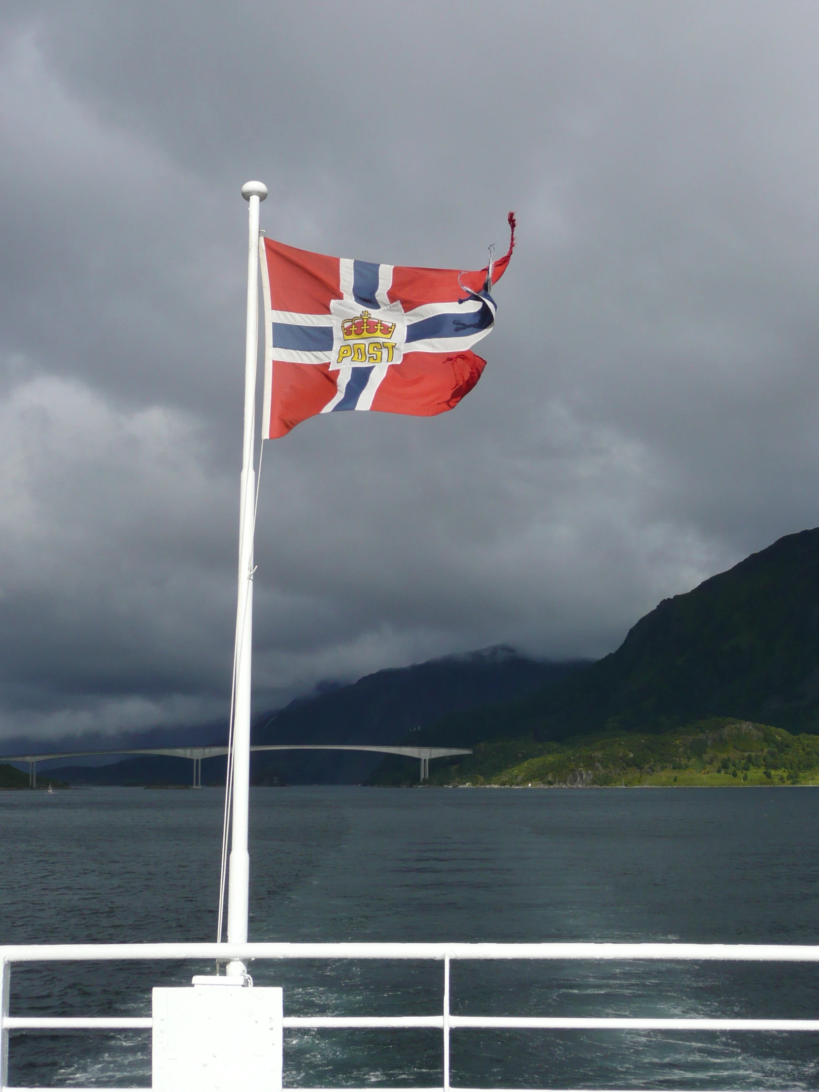 a flag is flying at the end of a boat